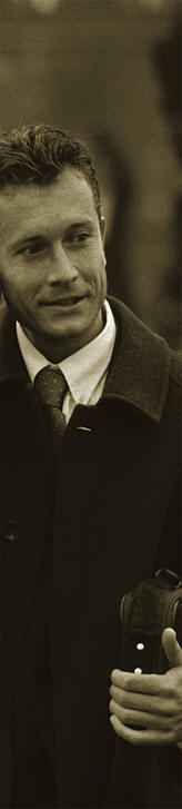 Male in  suit with cell phone